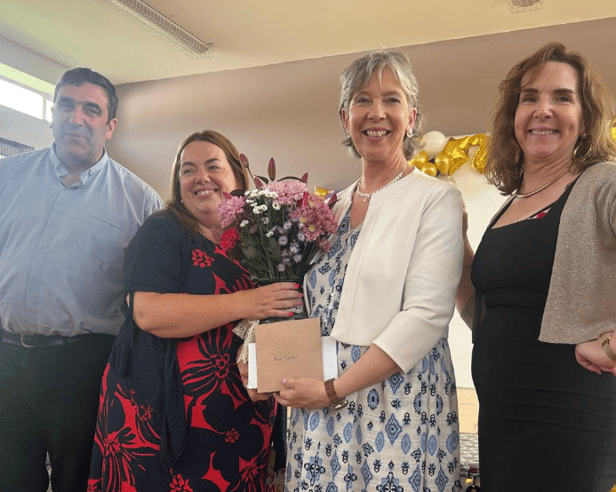 Flowers being presented to Ann Farrell