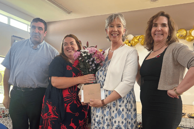 Flowers being presented to Ann Farrell