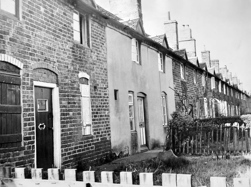 Extending in a long, continuous row, cottages 3 to 17 Old Row in Horsehay stand as a testament to East Shropshire’s proud industrial heritage. Pictured on 12 April 1968, the 14 early 19th-century homes were granted official protection under the 1962 Town and Country Planning Act as buildings of special architectural and historic interest within the Dawley New Town boundary. Originally built around 130 years earlier for Coalbrookdale Company workers, who paid less than half-a-crown a week in rent, the row still housed descendants of those pioneer ironworkers even as modern development pressed in. Do you have family connections to the old Coalbrookdale Company cottages at Old Row in Horsehay, or do you remember when these historic homes received their protected status in 1968?