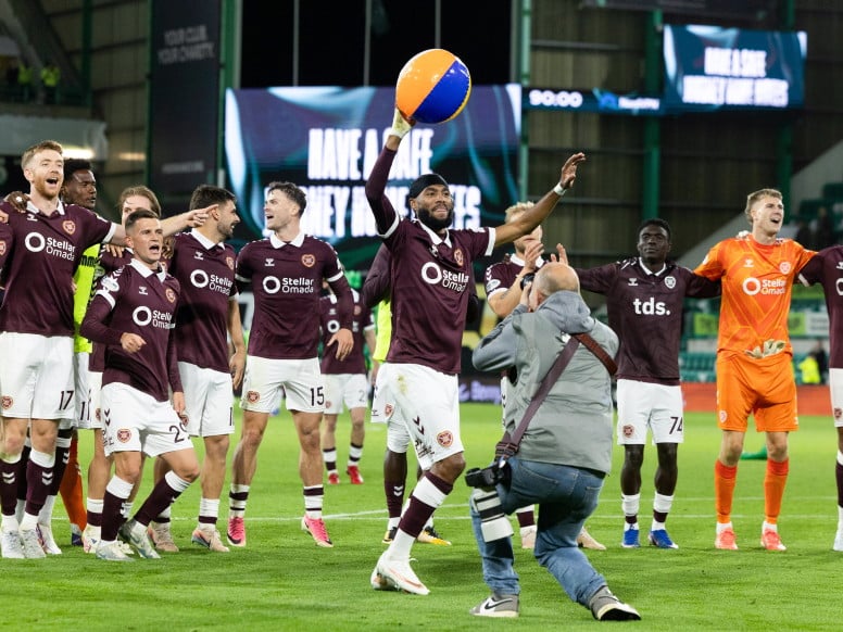 The Hearts players celebrate at full time