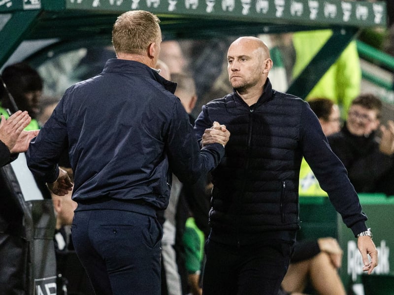 Hibernian head coach David Gray (R) and Hearts head coach Wouter Vrancken shake hands at full time 