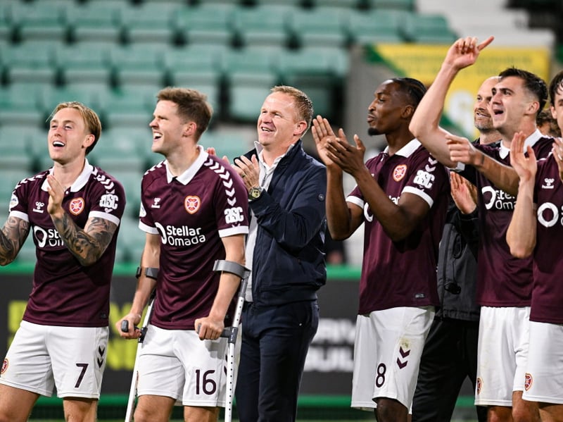 Hearts Head Coach Wouter Vrancken (C) celebrates with his players at full time