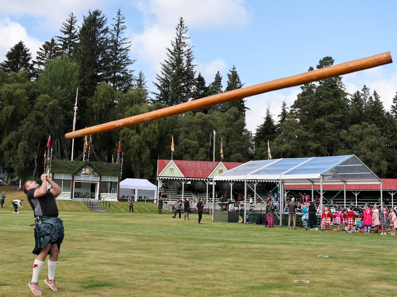 Tossing the caber at Braemar Gathering with the event one of the most anticipated of the sports contests 