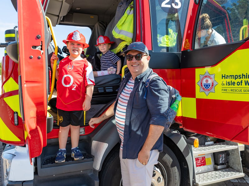 Martha and Joseph with dad Niall in the fire truck