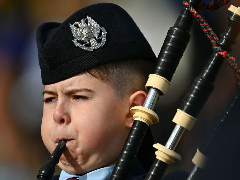 A young piper gives it his all at the Braemar Gathering 