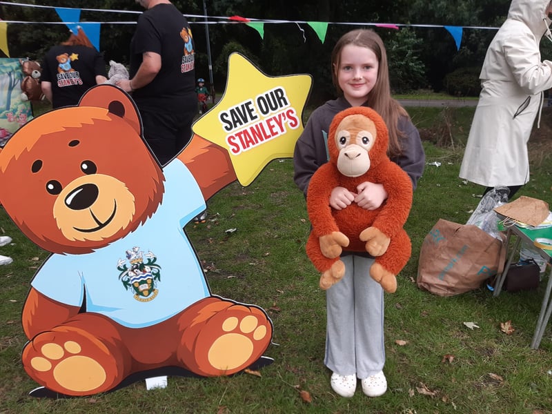 One youngster shows her support for the campaign with her cuddly monkey.