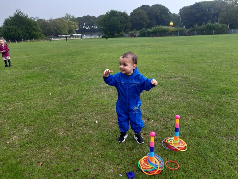 This youngster is having fun, despite the wet weather.