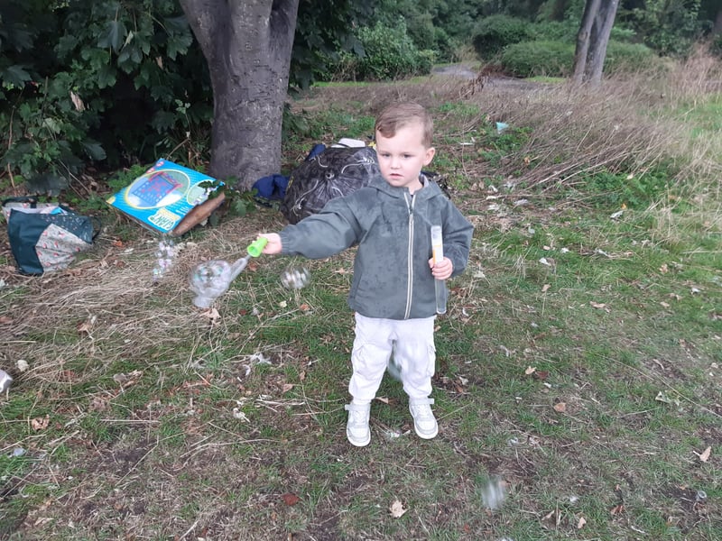 This youngster is having fun making bubbles