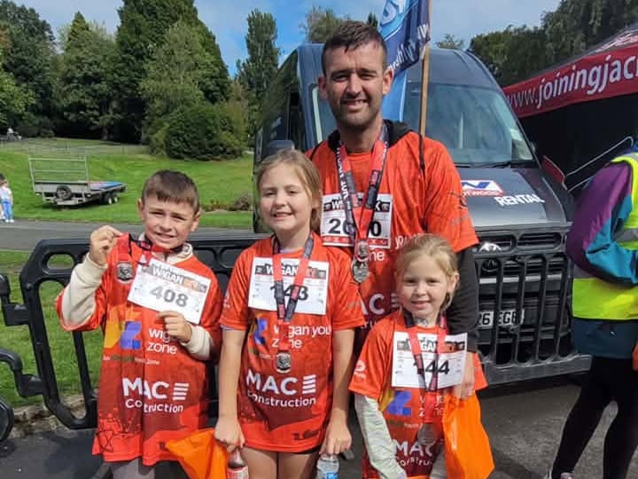 A family of runners with their medals
