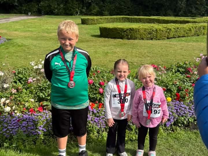 Albie, Isla and Amelie with their medals