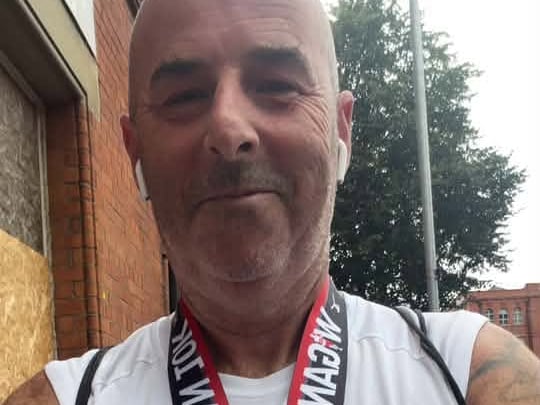 Nick takes a selfie with his medal