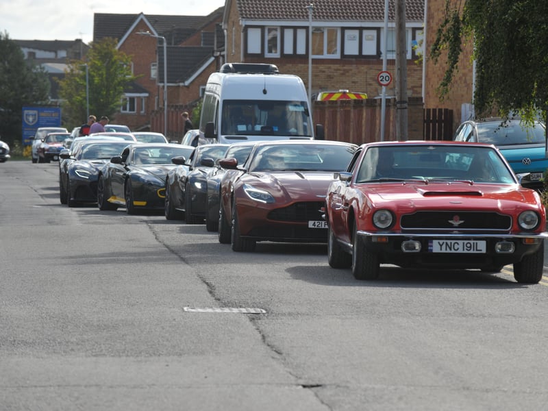 The parade heads to Farsley Town Street past Newlands from FC Farsley.