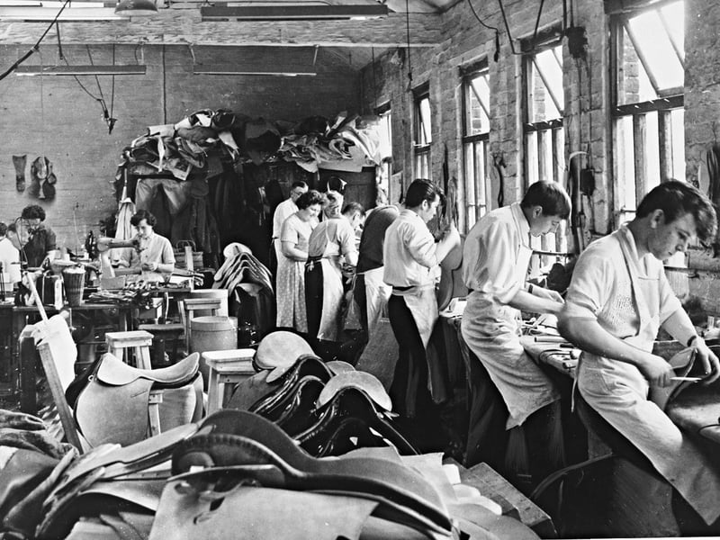 Skilled leatherworkers press on with their daily craft inside the bustling workshop of Modern Saddlery (Walsall) Ltd on Littleton Street in June 1962. Following a recent fire at the premises, the dedicated team found themselves working under far-from-ideal conditions, squeezed into a tightly packed saddle room surrounded by piles of leather cuts and completed saddles. Renowned as the traditional capital of Britain's leather trade, Walsall’s resilient saddlers refused to let a setback stop production, continuing to supply fine equestrian goods around the country. Did you or any of your family work in Walsall’s famous leather trade back in the 1960s?
