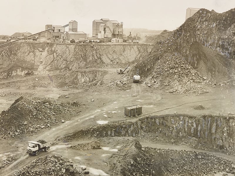 Heavy machinery and tipping lorries navigate the vast, rugged terracing inside Hailstone Quarry at Rowley Hills in October 1962. Quarrying in this area slowly reshaped the local landscape over generations, extracting the prized dolerite rock locally known as 'Rowley Rag.' Celebrated for its extreme durability, this hard dark stone was crushed and used extensively for road making and paving across Britain, keeping the men and machines at Hailstone Quarry working flat out throughout the post-war building boom. Did you or your family live near the Rowley Hills or remember the rumble of trucks from the local quarries back in the 1960s?