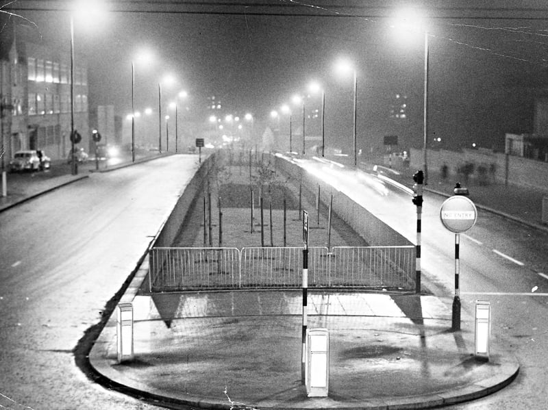 Glowing street lamps illuminate a newly completed stretch of Wolverhampton’s inner ring road on a misty night in November 1962. Taken to showcase the modern sodium street lighting installed along the dual carriageway, the photograph highlights the rapid post-war redevelopment reshaping the town centre. With its planted central reservation, fresh asphalt, and bright overhead lanterns, this section formed an early milestone in the major infrastructure project designed to bypass urban congestion and modernise Black Country motoring. Do you remember driving or walking along the new ring road when it first opened in the early 1960s?