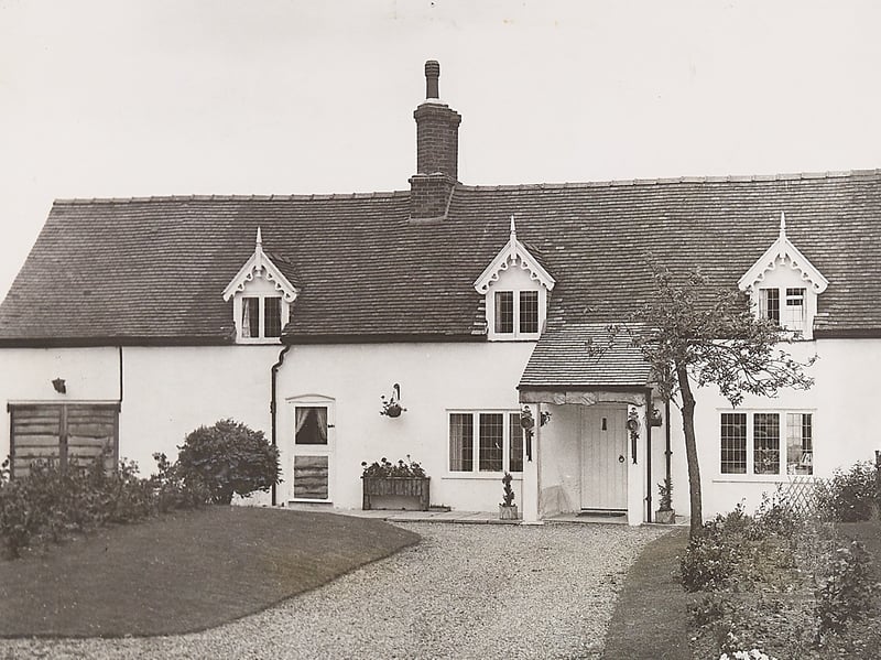 A picturesque view captures Keeper's Cottage on Cannock Chase in July 1962, following a thoughtful restoration project. Originally built as a pair of separate dwellings for the Marquis of Anglesey’s estate gamekeepers, the two properties were carefully converted into a single, eye-catching family home. Great care was taken during the renovation to preserve their traditional architectural features - including the ornate wooden gables and classic lattice windows - maintaining a charming link to the Chase's rich ducal history. Do you remember seeing this idyllic cottage or exploring the surrounding trails of Cannock Chase in the 1960s?