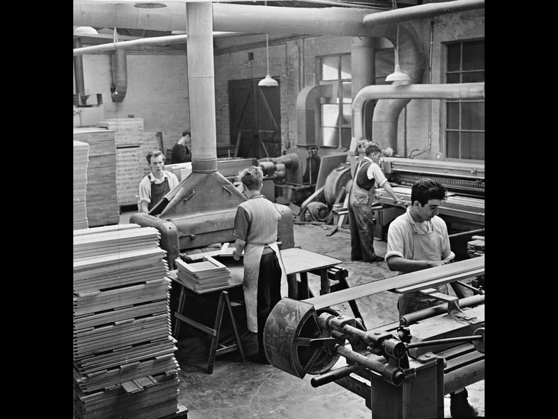 Woodworkers operate heavy sanding machinery inside the bustling workshop of the Burndale Office Furniture Company Ltd. in Tividale, Tipton, in August 1962. Surrounding themselves with neat stacks of timber, the skilled craftsmen ensure each wooden component receives a smooth, precise finish before moving on to final assembly. As demand grew for modern commercial furnishings during the 1960s, local manufacturing firms like Burndale kept the Black Country at the forefront of quality British woodworking. Did you or anyone in your family work in the woodworking or furniture trade around Tipton in the 1960s?