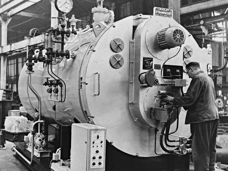 An engineer makes final adjustments to a massive "Steampacket" packaged economic boiler at Cradley Boiler Co. Ltd., located on Wood Lane, Cradley Heath, in October 1962. Capable of evaporating 10,000 lbs of steam per hour, this fully automatic, oil-fired unit was the second of a pair built specifically for dispatch to the BSR (Birmingham Sound Reproducers) factory at Stourbridge. The impressive order showcased the strength of local Black Country engineering firms in powering the region’s booming post-war manufacturing industries. Do you or any of your family remember working at Cradley Boiler Co. or BSR back in the 1960s?
