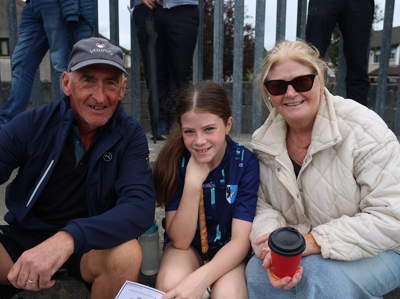 Isabella Sheehan with Breda and Mark Hayes watching Ballybrown v Monaleen 