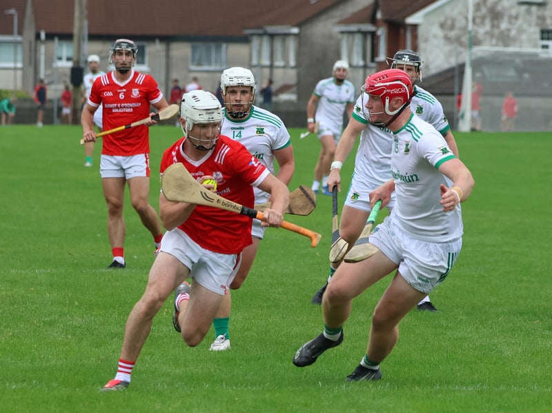 Noel Clancy of Monaleen in action against Ballybrown's Barry Adams