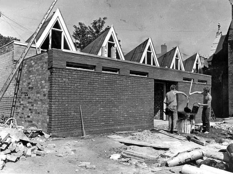 Workmen hard at work on the construction of a new social centre for St Michael's Catholic Church in West Bromwich. The build cleverly incorporated brickwork from a 100-year-old former primary school that had previously closed its doors in 1962. Spearheaded by parish priest Father Thomas O'Connor, the project was made possible thanks to five years of dedicated community fundraising, including weekly draws and sponsored walks organised by local parishioners. Do you remember the old primary school or attending events at St Michael's parish social centre?