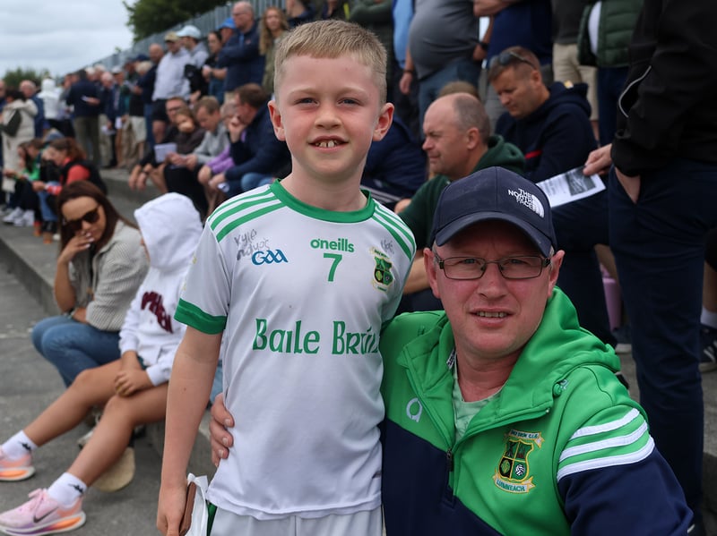 Pa and Scott Lyons watching the Ballybrown v Monlaeen game