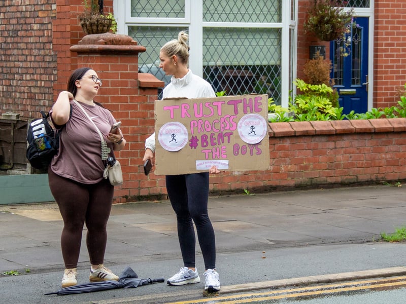 Supporters holding a motivational sign. Picture: AM Standish