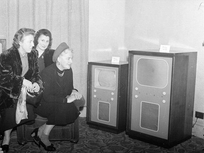 Singer Gracie Fields checks out the latest televisions in Jenners Department Store in November 1952.