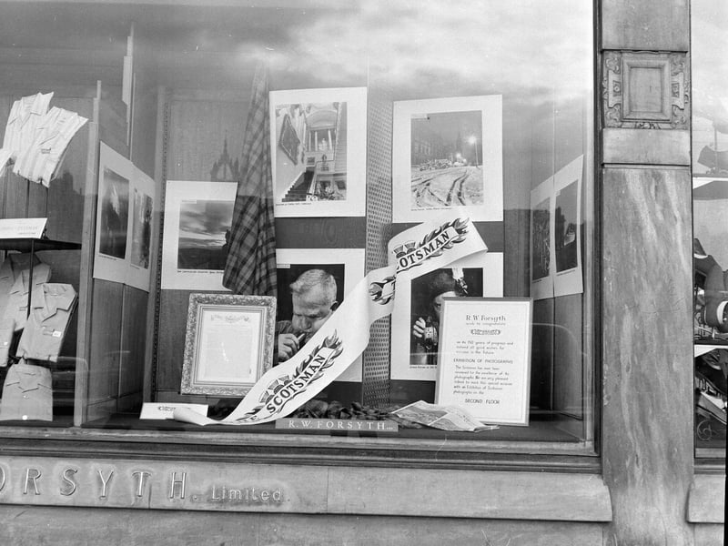 A dispay of photographs from The Scotsman in the window of R Forsth Department Store on Prices Street to mark the newspaper's 150th anniversary in April 1965.