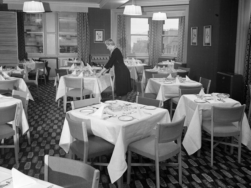 A waitress sets the tables for the Rose Room restaurant in Grants Department Store, North Bridge, in November 1955.