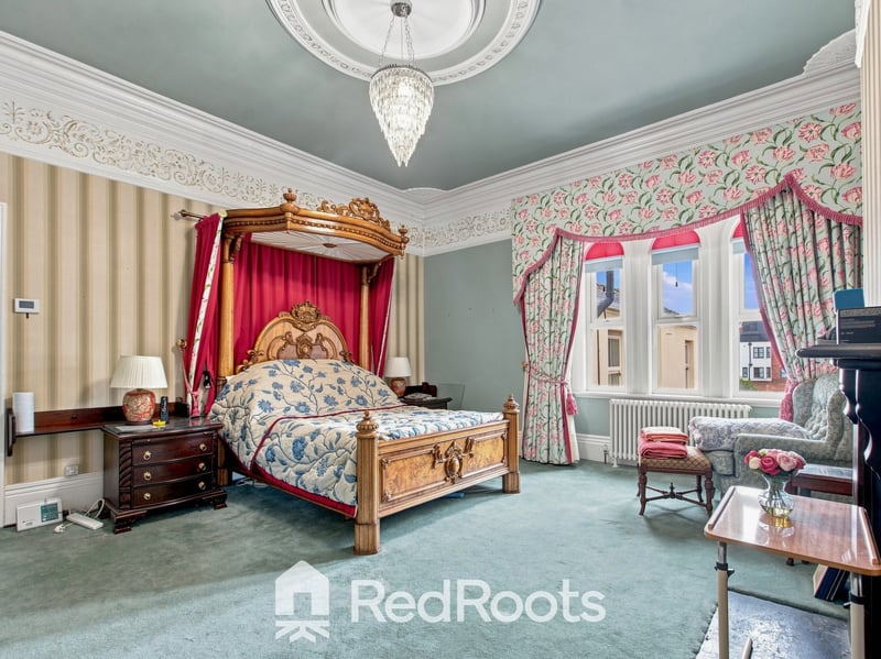 Self-Contained Top Floor Annex: Includes a top-floor kitchenette and vaulted-ceiling bedrooms, perfect for multi-generational living or live-in staff.