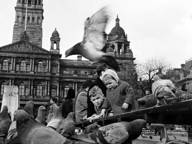 Children feeding pigeons in George Square in Glasgow in March 1966.