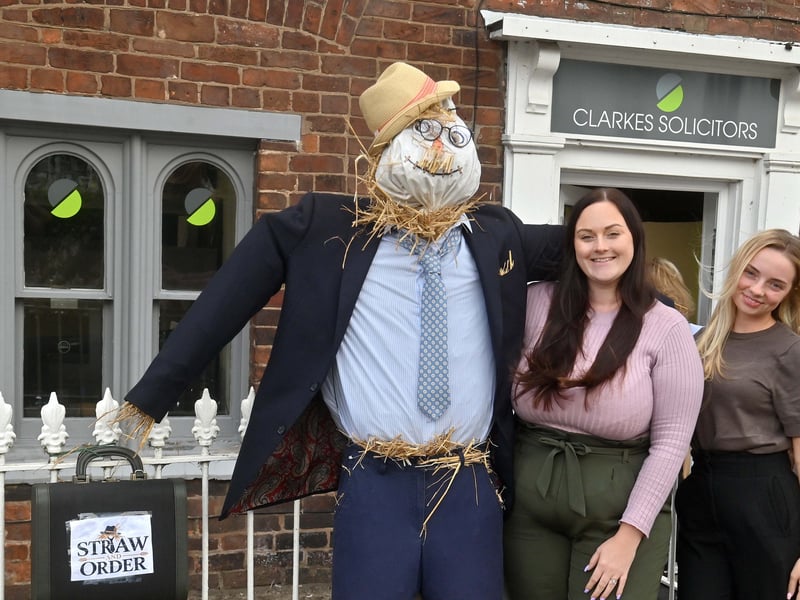 Katie Humphreys, Louise Turner and Courtney Harte from Clarkes Solicitors with the scarecrow created for Shifnal's Scarecrow Festival.