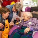 Ms Maureen Finn chatting with Neighbour Jessie Collins and her grandson Ben on the occasion of her 100th Birthday party in Riada House, Tullamore.