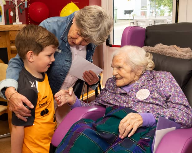 Ms Maureen Finn chatting with Neighbour Jessie Collins and her grandson Ben on the occasion of her 100th Birthday party in Riada House, Tullamore.