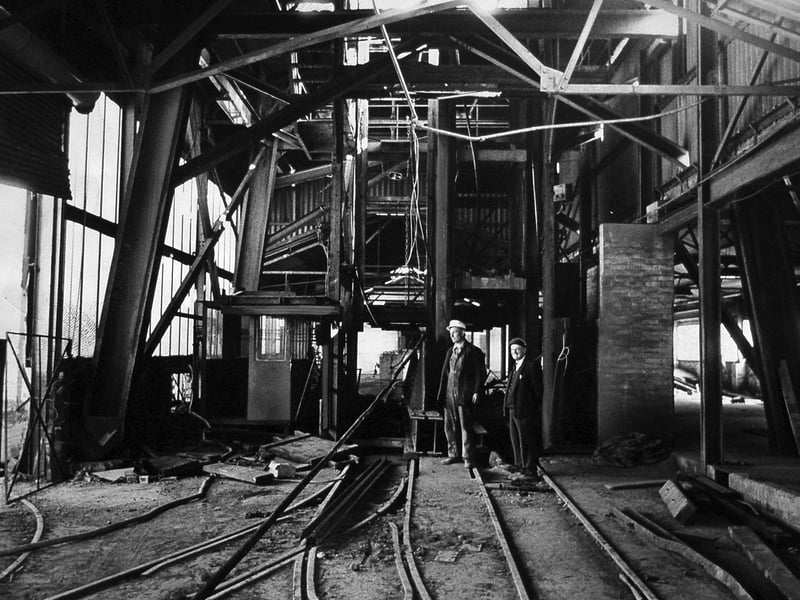 Shaft team overman Joe Bishop and acting electrical engineer Bill Bolton check the top of a 225-yard shaft at Cannock Wood during the same operation in 1974.