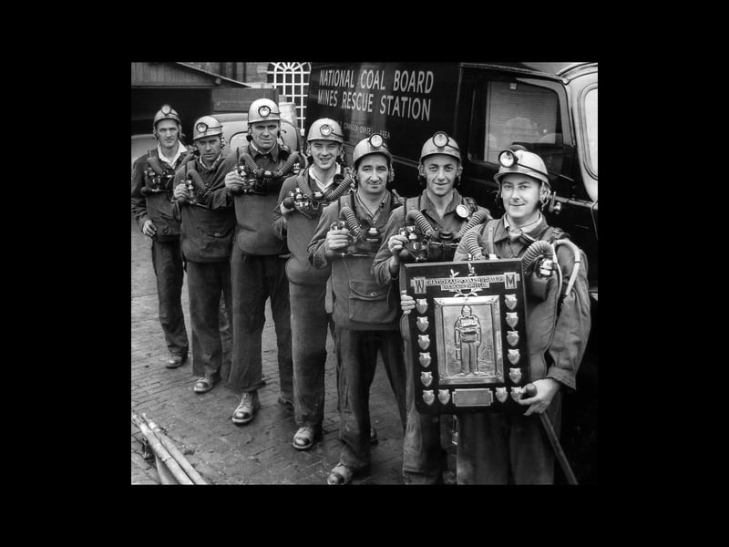 Cannock Wood Colliery rescue team, who were the winners of the National Coal Board mines rescue shield at Madeley in 1964. Pictured at the Miners Rescue Station, Hednesford, they are, from left, M D Wood, J Magulski, F Mighalls, J M Douglas, J Hogarth, G Oldacre and, holding the trophy, the captain, A R Yearsley.