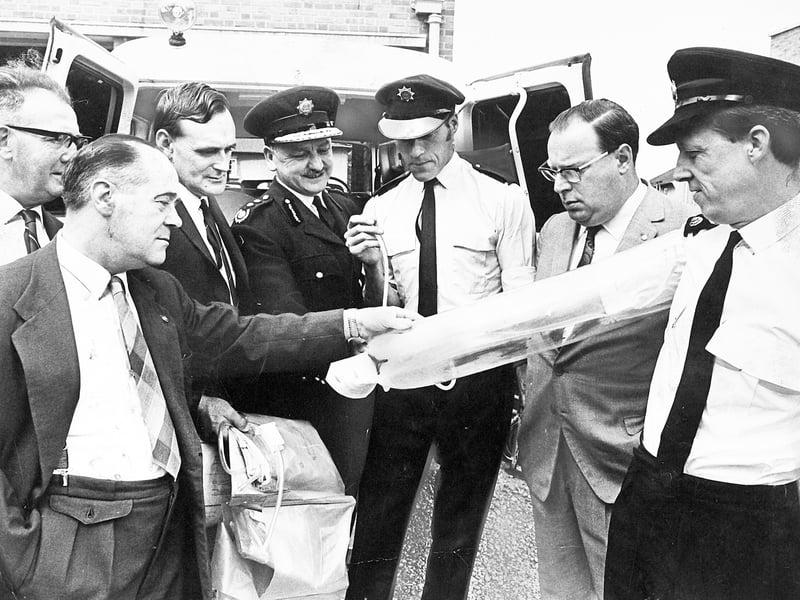 Members of the Wolverhampton fire and ambulance service committee look on with interest during an official tour of the town's stations on July 23, 1969. Station officer Mr W Rittle and ambulance driver J Brindley demonstrate the practical application of revolutionary inflatable "blow-up" splints designed for treating fractured limbs in emergency situations. The demonstration group included Councillor J Crutchley, Alderman S Reynolds, Councillor D. Daly, Chief Fire Officer Mr S Keeley, and Councillor T Guy, highlighting Wolverhampton's commitment to adopting modern medical equipment for emergency response. Do you remember when inflatable splints were first introduced to emergency services in Wolverhampton?