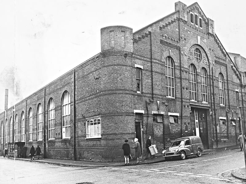 Pedestrians walk past the impressive brick facade of the former Drill Hall on Stafford Street, Wolverhampton, in this archive view from January 1969. The striking building was at the centre of ambitious new redevelopment proposals going before the town council for approval, aiming to convert the military site into a dedicated multi-sports centre for the local community. Do you remember visiting the old Drill Hall on Stafford Street or taking part in sports activities there after its conversion?