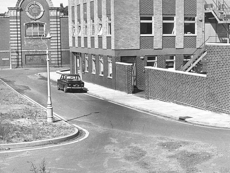 A solitary car sits parked up along a quiet link road leading off Bath Avenue in June 1969, where council road painters got a bit carried away with their brushes. The single yellow line, laid down along the thoroughfare towards the car parks at the rear of Waterloo Road, was actually applied entirely in error. The mix-up left local motorists temporarily baffled over whether parking was permitted along the short stretch in Wolverhampton town centre. Do you remember this cheeky road marking blunder in Wolverhampton back in the summer of 1969?