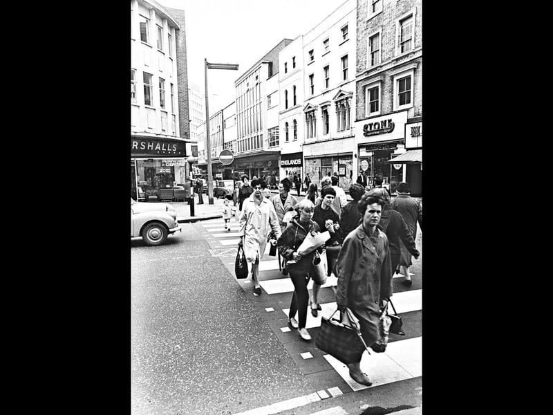 Pedestrians stream across Market Street on September 17, 1969, as a major upgrade to local traffic control makes its debut. Wolverhampton became one of the very first towns in the country to introduce the innovative new "pelican" crossing system, installed to replace a traditional zebra crossing that was frequently monopolised by foot traffic. By giving push-button priority to both shoppers and motorists, the fresh signal design aimed to relieve severe congestion along the busy shopping thoroughfare in Wolverhampton town centre. Do you remember learning how to use the new pelican crossing on Market Street in Wolverhampton back in 1969?