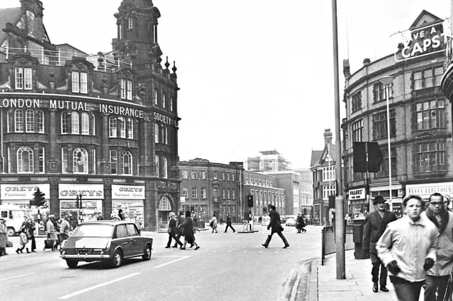 Pedestrians cross the road and shoppers go about their day in February 1969, captured in a vibrant view looking down Lichfield Street towards Stafford Road. Dominating the left of Princes Square is the magnificent architecture of the Royal London Mutual Insurance Society building, with Greys Television Centre and Electrical shop occupying the ground floor. Across the way, storefronts including Fleet Electrics and a Capstan cigarettes sign frame the bustling town centre, showcasing a classic slice of daily life in 1960s Wolverhampton. Do you remember visiting Greys or Fleet Electrics when shopping around Princes Square back in 1969?