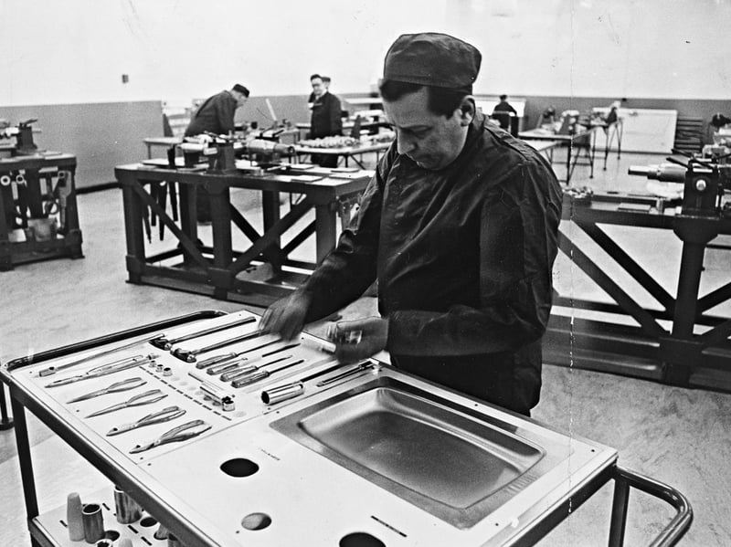 A technician carefully organises tools on a stainless steel bench inside the ultra-clean assembly room at Boulton Paul Aircraft in Wolverhampton on January 14, 1969. Working on the final assembly of complex power control systems, staff in the pressurised, air-filtered facility wore protective clothing that was laundered daily to prevent dust particles from contaminating vital flight components. The photograph highlights the painstaking standards of precision engineering that made Wolverhampton a powerhouse of the British aviation industry. Did you or a family member ever work at the Boulton Paul factory in Wolverhampton?