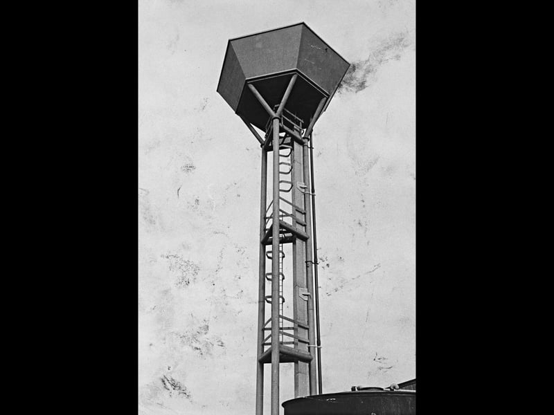 The striking steel-framed water tower at the GKN Group research centre in Lanesfield, Wolverhampton, rises high against the sky in October 1969. Built to serve the advanced industrial research facilities on site, the distinctive hexagonal structure was named as one of eight prize-winning entries in a prestigious national structural steel design scheme. Recognised for its bold engineering and functional modern aesthetic, the tower stood as a symbol of GKN’s innovation and commitment to cutting-edge development in the region. Do you remember seeing this unique GKN water tower rising above the Lanesfield landscape in Wolverhampton?
