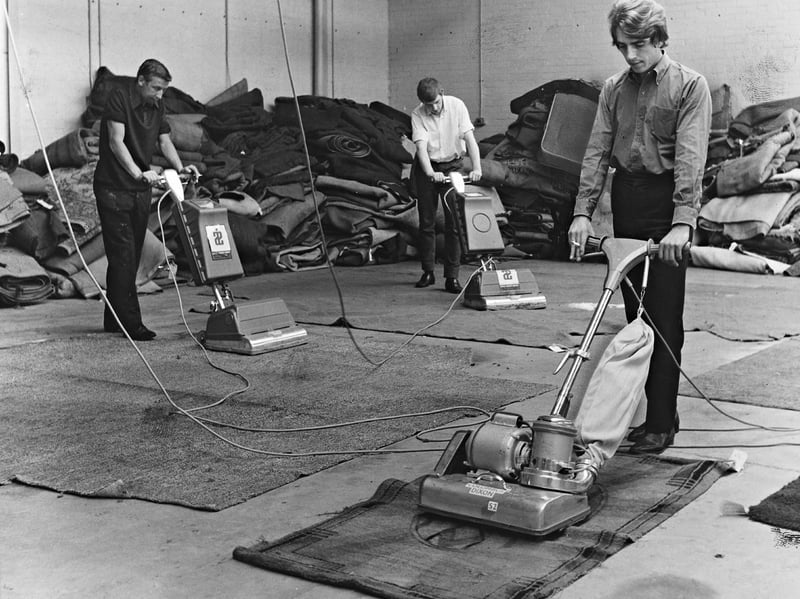 Workers guide heavy-duty floor buffers and vacuum extractors over sodden rugs in October 1969 as part of a major salvage effort. Andrews Industrial Equipment Ltd, a Wolverhampton-based general heating and cleaning equipment hire firm, deployed high-speed carpet machines to treat thousands of flood-damaged carpets following severe water damage in the Thames Valley. Operating out of the Pytram Factory in West Molesey - one of six temporary drying centres set up in disused hangars, warehouses, and factories by Esher Urban District Council - the local firm played a key role in restoring household furnishings for disaster-hit communities. Do you or your family remember Andrews Industrial Equipment Ltd. or the various specialised machinery hire firms that operated out of Wolverhampton in the late 1960s?