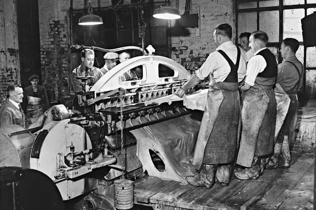 Skilled tanners feed heavy cowhides through a massive splitting machine at a Walsall leatherworks in May 1962. Dressed in protective aprons and heavy boots, the workforce carefully manages the delicate, highly precise process that slices thick hides into uniform sheets ready for finishing. As the heart of the nation’s saddlery, harness, and fine leather goods trade, Walsall’s tanneries relied on the master craftsmanship and expertise of local workers to supply high-grade materials across the globe. Did you or anyone in your family work in the famous Walsall leather trade back in the day?