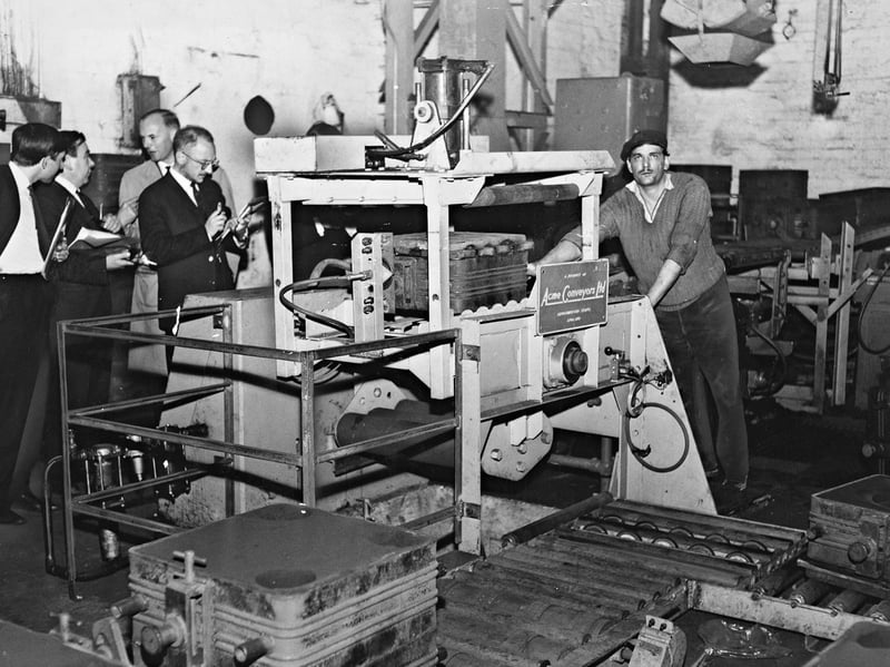 A team of inspectors and management figures look on as an operator demonstrates the newly installed Acme Conveyors mechanised moulding line at H. Lindop’s foundry in Walsall in September 1965. The impressive state-of-the-art plant was capable of producing heavy iron castings weighing up to 200 lb, marking a major step forward in efficiency for the local metalworks. As one of the borough’s key engineering firms, Lindop's invested heavily in modernising its facilities to keep up with the booming industrial demand of the mid 1960s. Did you or a relative ever work on the factory floor at Lindop's foundry?
