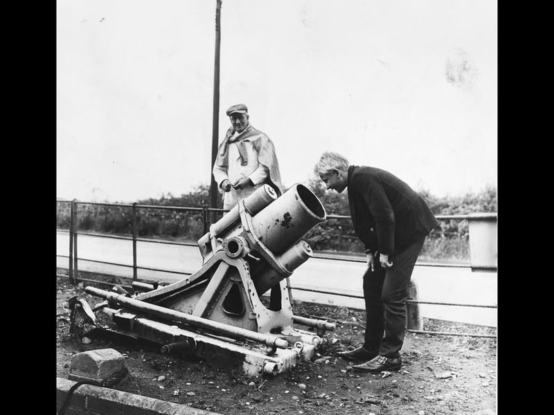 Young Phillip Harrison peers curiously down the barrel of a First World War German trench mortar displayed outside Brownhills Car Sales in August 1965. Serving as a rather striking and unusual ornament to draw in passers-by and motor trade customers, the heavy 1914–18 relic made quite the talking point along the roadside. The peculiar sight captured the imagination of local motorists and shoppers alike, blending wartime history with a bit of classic Black Country garage enterprise. Do you remember spotting this curious mortar sitting on the forecourt as you passed through Brownhills?