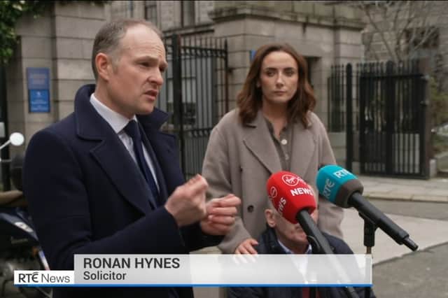 Ronan Hynes speaking outside the Four Courts with Anthony Bourke, and Sinead Stapleton