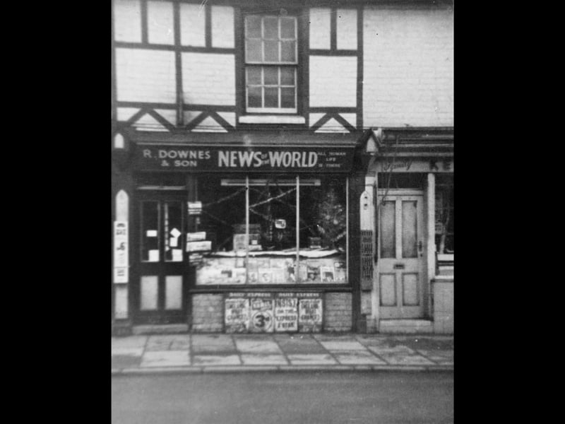 The timber-framed facade of R. Downes & Son newsagents on Brownhills High Street, pictured around 1964. Adorned with classic newspaper posters and hand-painted shopfront signs advertising national dailies and the local Express & Star, the family-run business stood as a fixture of daily community life. Believed to be one of the longest-serving local businesses in the area, the shop was a go-to spot for morning papers, magazines, and sweets for generations of local residents. Did you use to pop into Downes to buy your morning paper or pick up a comic on the way home from school?